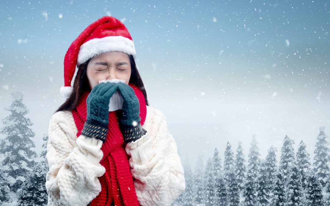 Asian woman with winter gloves and Santa hat get flu sneezing on the snowfield