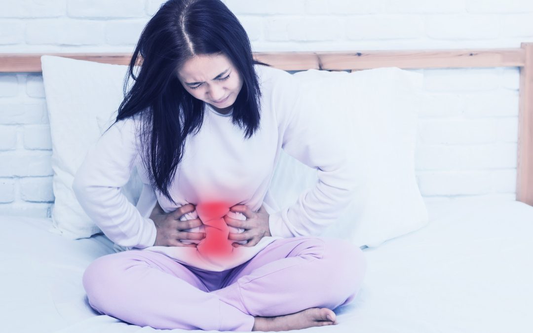 a young woman grapples with the discomfort of stomach pain