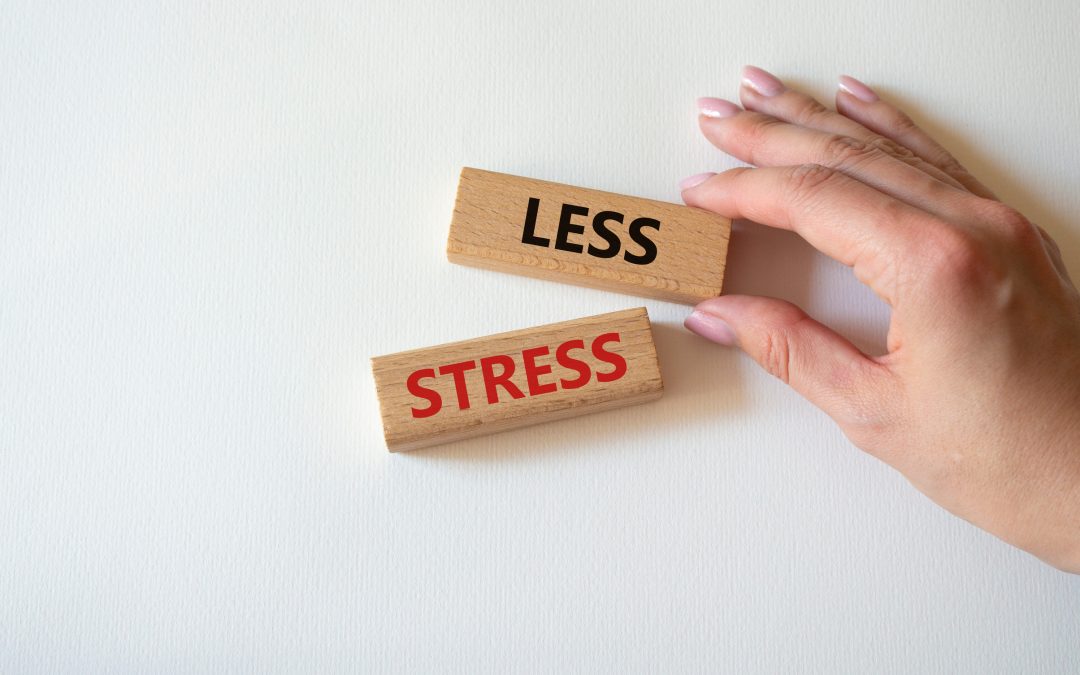 Wooden blocks with words Less stress