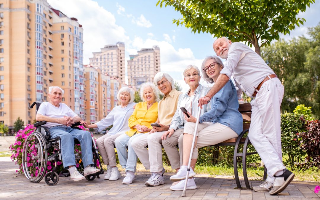 group of seniors sitting with one standing